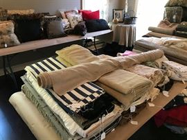 Many bolts of designer fabrics.