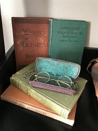 Antique glasses and medical books.