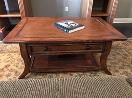 Large size coffee solid wood table holds lots of storage.