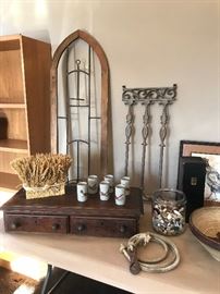 Antique storage drawer and pottery.  Wooden and iron decorative items.