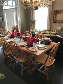 Large farm table and 6 solid wood chairs.  Several fun Christmas place settings.