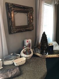 Many table linens, candles and accessories in neutral colors.