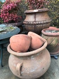 Matching terra cotta wall pockets. 