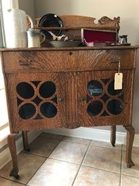 This is a wonderful antique tiger oak buffet!  It would make a perfect coffee station or display for those special dishes!