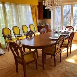 Henredon table and chairs. Two sets of six in coordinating styles.