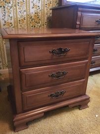 Bedroom set is solid maple. Beautiful. These pieces are covered with glass.