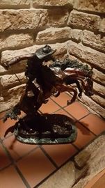This is an awesome bronze around to feet Frederic Remington it's a beautiful piece to add to your collection