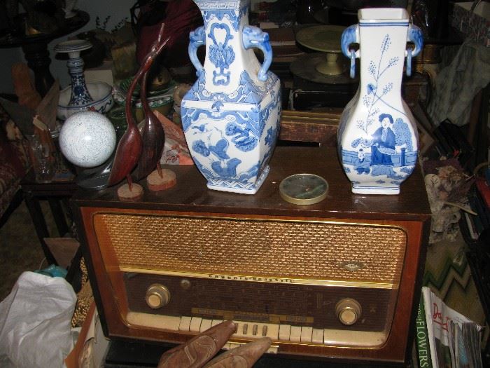 vintage radio, blue and white vases, wood sculptures