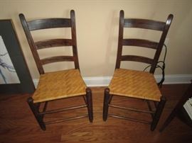 Pair of antique thumb back ladder back chairs
