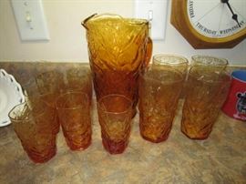 Anchor Hocking ? amber pitcher, 4 tall and 7 short glasses