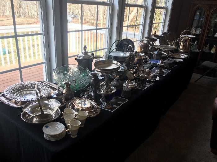 Tons of silver plate items and entertaining pieces. Straight through the hallway to the right. 