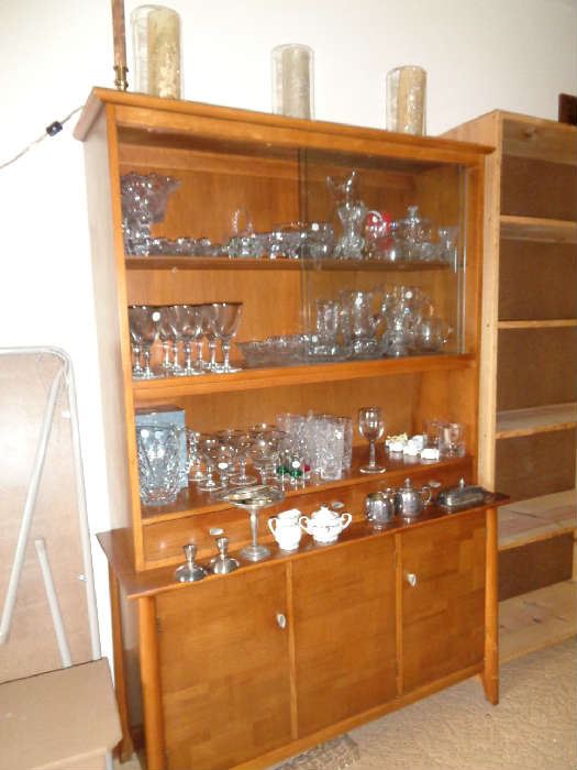 mid century walnut china cabinet, filled with cut & pressed glass, we have a few pieces of sterling & some costume jewelry