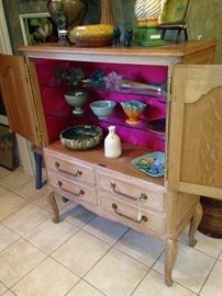 French Country armoire/cabinet has shelf and drawer storage.