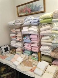 Many towels, sheets, and pillow cases