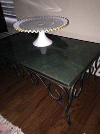 Low table with marble top; white (trimmed in gold) cake plate