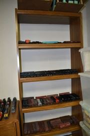 Train cars on shelf including coal cars