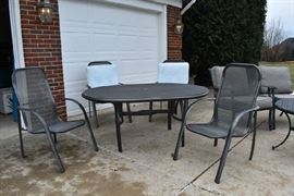 Outside patio chairs with 4 chairs with a large umbrella to match.