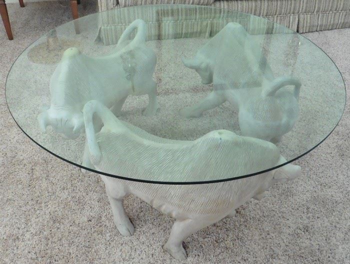 Three bulls glass top coffee table.