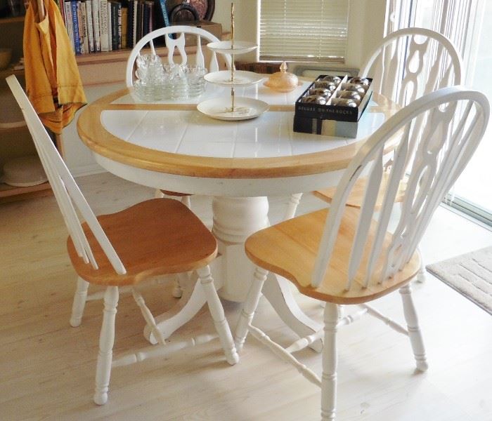 Casual white tile top dining table with 4 chairs, one leaf