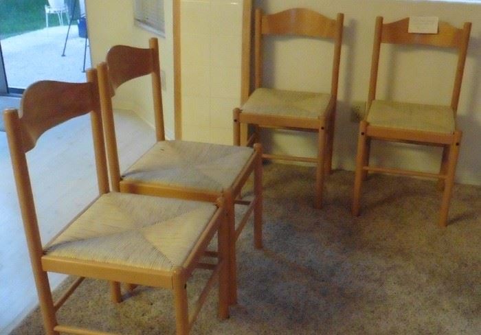 Four wood chairs with rush seats