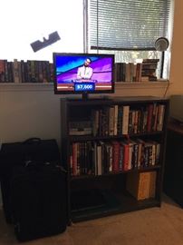 tv, luggage, books