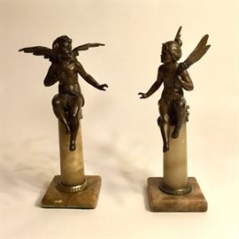 Spelter figures on onyx bases.