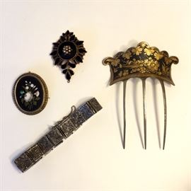 Assortment of antique jewelry in gold and sterling.