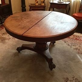 Mid-19th century tilt-top, claw foot, center table.
