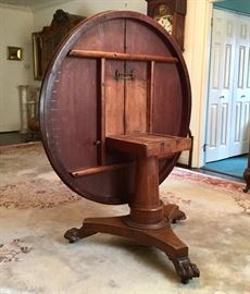 Mid-19th century tilt-top, claw foot, center table.