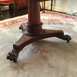 Mid-19th century tilt-top, claw foot, center table.