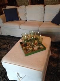 Slip-covered 3-cushion sofa and ottoman