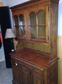 The hutch provides display and storage area (lamp not for sale)
