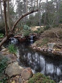 Pass the water fall and pond on the way to the boathouse.