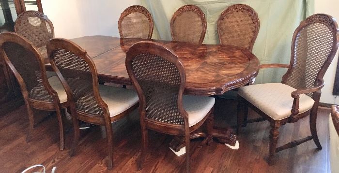 Oval wood dining table with pedestal base, 2 leaves, 8 chairs