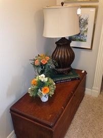 Another cedar chest; floral arrangements; lamp