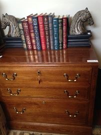 File cabinet with key; horse head bookends; leather bound books