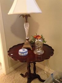 One of two matching side tables; lamp and other decor