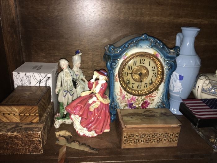 Porcelain 1880's clock, porcelain figurines, carved keepsake boxes, vintage Greek Metaxa bottle.