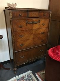 Tall antique dresser with brass details