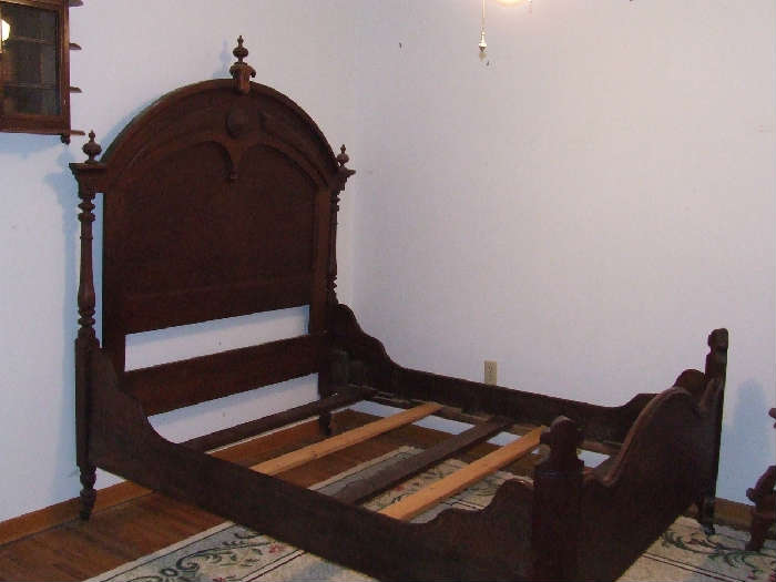 This is one of the gorgeous antique full beds.  It is hard to tell from the photo, but the head board stands an impressive 6 feet high.  The bed is very sturdy!