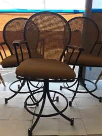 Vintage cane back swivel chairs