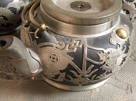 Clay with pewter overlay, dragon motif