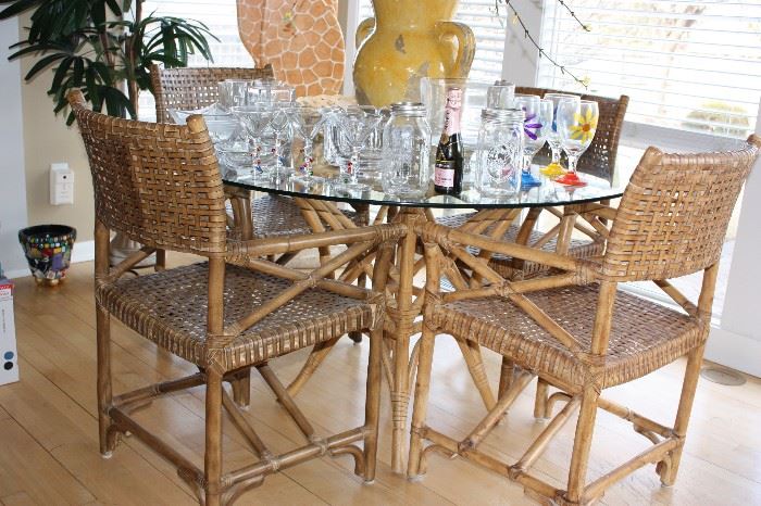 Rattan and leather chairs with glass topped rattan table