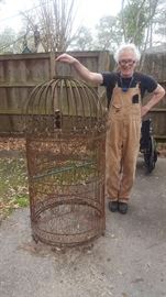 Giant birdcage!  The guy is not for sale.   ;-))