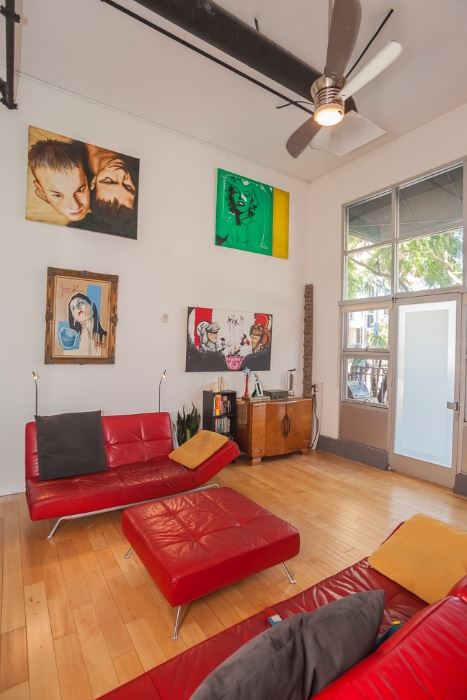 Lignet Roset "Smala" sofa, love seat and ottoman. 1940s wood buffet, various original art.