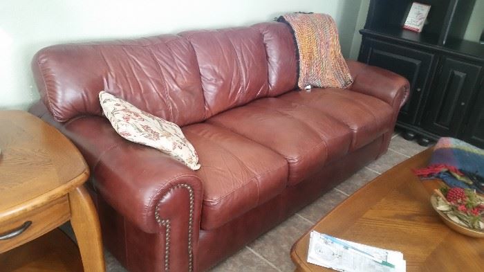 LaZ-Boy classic style leather sofa, rolled arms, antique brass nail head trim.