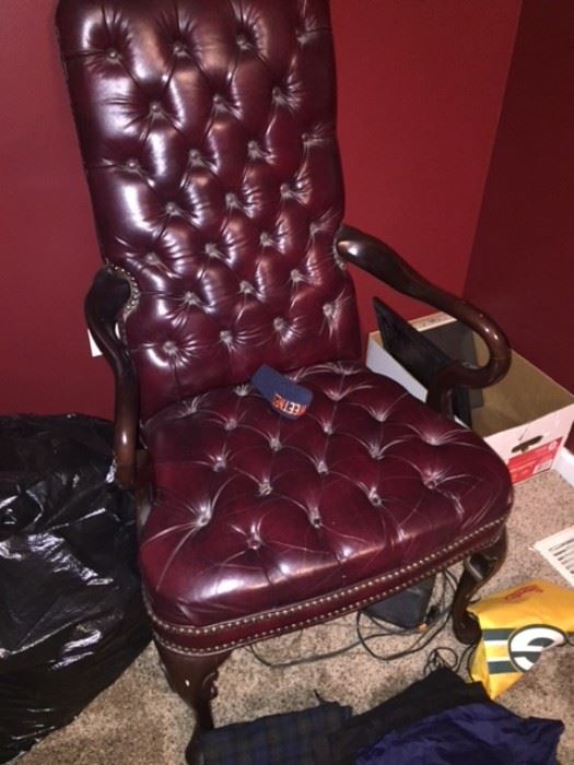 There are two of these gorgeous burgundy leather chairs