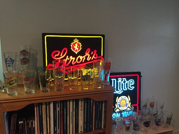 Some of the beer signs and a TINY portion of the loads of beer glasses we are selling!