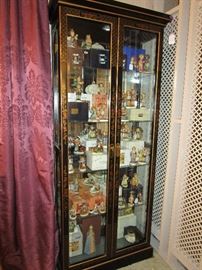 Front View Of Oriental Looking Pulaski Curio Cabinet Filled With Many Hummels