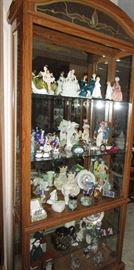 One of Two Ashley Curio Cabinets . This One Has So Much Variety In It. The Royal Doulton Figurines, Belleek China Pieces, Victorian Style Figurines, Antique England Pitcher, Wedgewood, Music Boxes, Dresden, and more